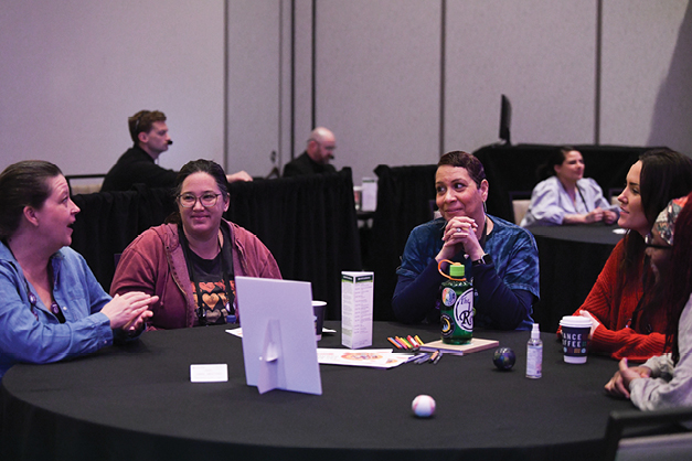  HR conference attendees in discussion 